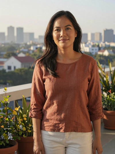 Nari enjoying a serene morning on a balcony with plants and soft light